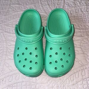 Green/Teal crocs,Slightly used,In Great Condition. Men’s size 7 Women’s size 9.